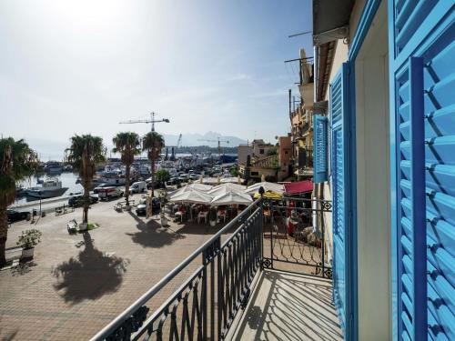 a balcony with a view of a marina at Pleasant Holiday Home in Santa Flavia in Santa Flavia