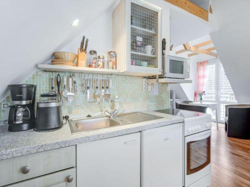 a kitchen with white cabinets and a sink at Apartment in Sch now in Berlin Brandenburg in Bernau bei Berlin