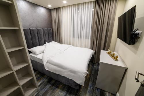 Ένα ή περισσότερα κρεβάτια σε δωμάτιο στο Apartmani Milanovic