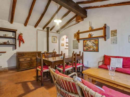 a dining room with a table and chairs at Belvilla by OYO Loggetta in San Marcello Pistoiese