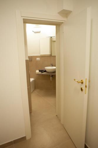 an open door to a bathroom with a sink at CasaPaola b&b Rooms in Acireale