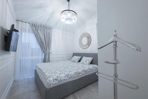 Cama ou camas em um quarto em Godos apartamentai