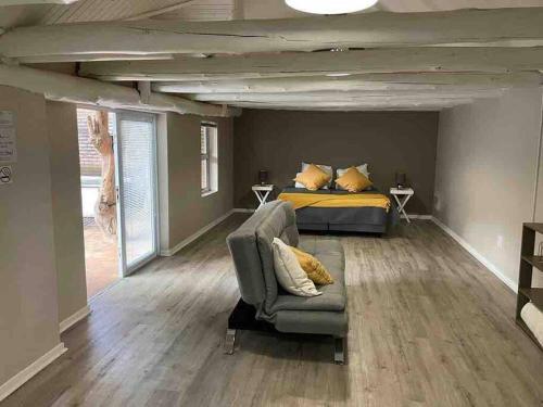 a bedroom with a bed and a couch and a bed at Grace Gardens - Grace in Pretoria