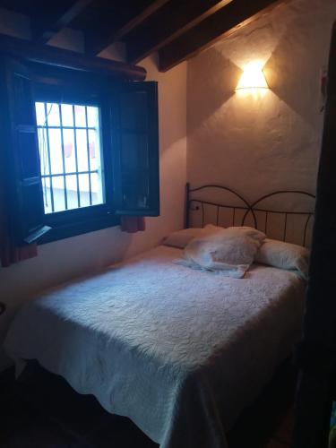 Postel nebo postele na pokoji v ubytování La casita de Manuel