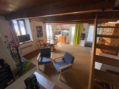 an aerial view of a living room with a table and chairs at Rustico la Stalla in Gordevio