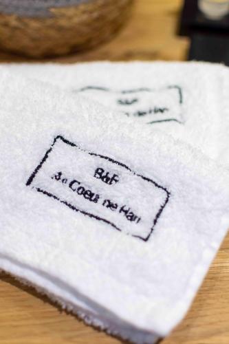 a towel with the words but no cash no hell on it at B&B Au Cœur de Han in Han-sur-Lesse