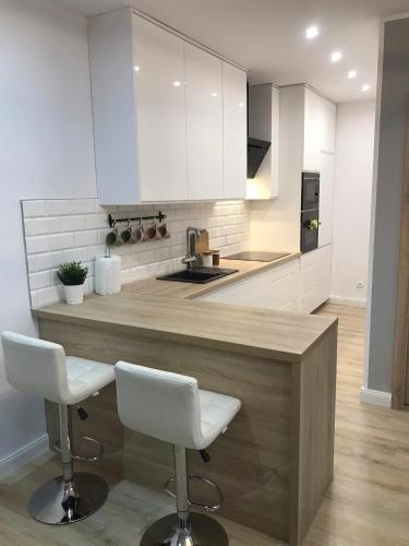 Kuchyň nebo kuchyňský kout v ubytování Apartament Nowodworska
