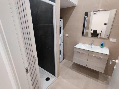 a small bathroom with a sink and a mirror at Bilocale incantevole a Barletta - Puglia in Barletta