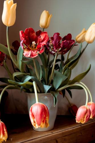 a vase filled with flowers sitting on a table at Hotel Limmerhof in Taufkirchen
