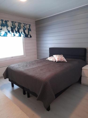 Un pat sau paturi într-o cameră la Villa Wältti