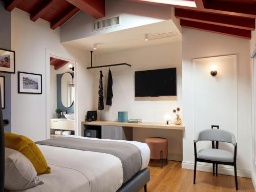a bedroom with a bed and a desk at Ca’ Prandini in Maranello