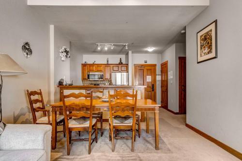 a kitchen and dining room with a table and chairs at Powderhorn Lodge 107: Columbine Suite in Solitude