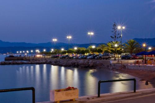 a view of a body of water at night at Hotel Miramare in Pylos