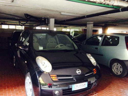 a small car parked in a parking garage at Corallo Wellness Hotel in Diano Marina