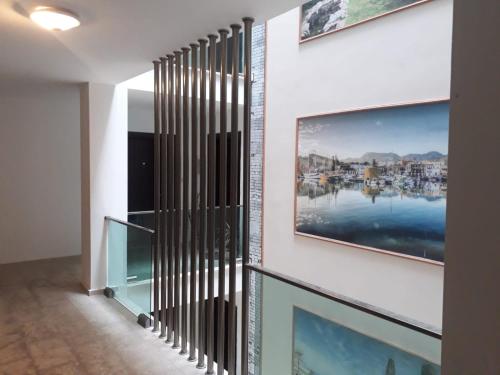 a hallway with a wall with two paintings on it at Ardem 5 Girne Luxury 1+1 in Kyrenia