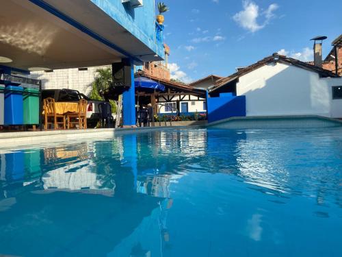 Bazén v ubytování HOTEL BRISAS DE SANTA FE nebo v jeho okolí