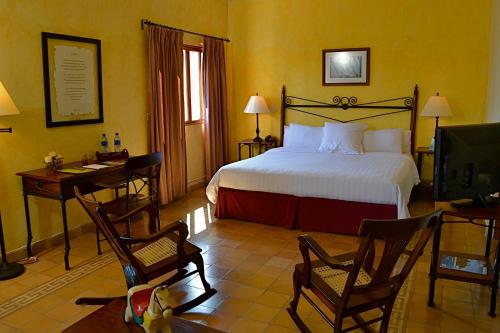 Postel nebo postele na pokoji v ubytování Hotel Dario Granada