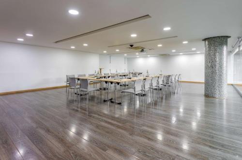a large room with a long table and chairs at Sonesta Hotel Bogotá in Bogotá