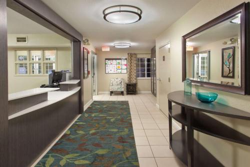 a corridor of a hospital room with a hallway at Sonesta Simply Suites Dallas Las Colinas in Irving