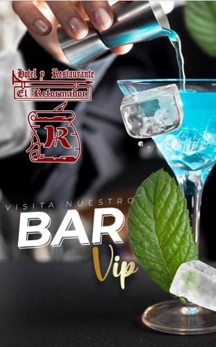 a poster for a bar with a person pouring a drink at Hotel El Reformador in Puerto Barrios