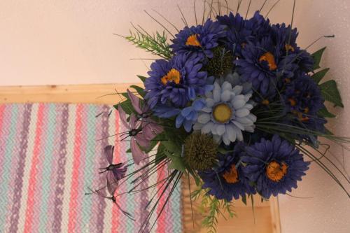 a bouquet of blue flowers in a vase at sonnberg in Ischgl