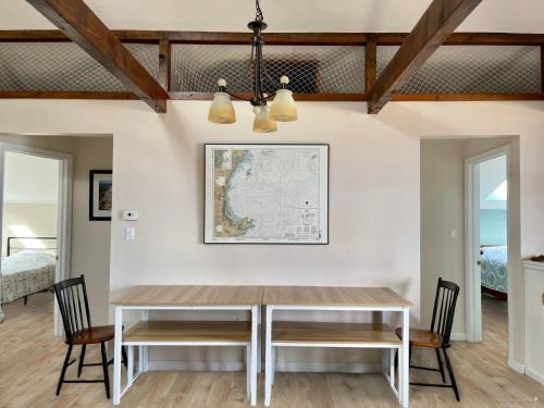 a dining room with a table and chairs at Oceanfront Penthouse with Family & Friends in Salisbury