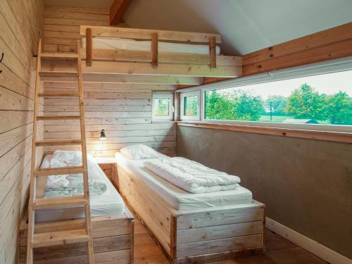 Ein Bett oder Betten in einem Zimmer der Unterkunft High Fens Nature & Sauna Stay