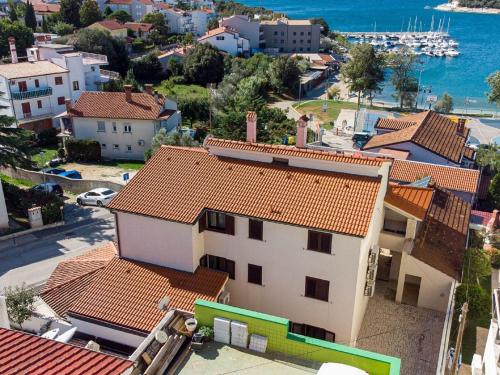 an aerial view of a town with houses and the water at Modern apartment near the beach in Istria in Vintijan