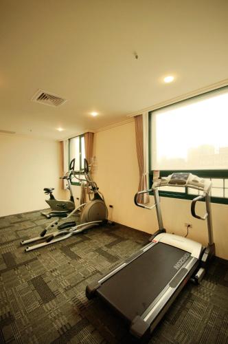 a gym with two exercise bikes in a room at Yaling Hotel in Magong