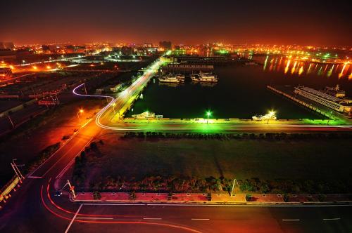 a view of a city at night with lights at Yaling Hotel in Magong