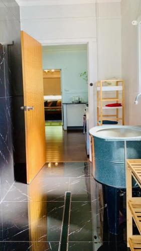 a kitchen with a black refrigerator in a room at Parker st in Cootamundra