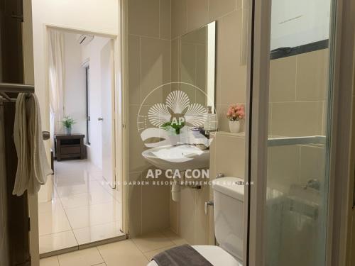 a bathroom with a toilet and a sink in it at SG Resort Residences Kuantan by AP CA CON in Kampung Sungai Karang