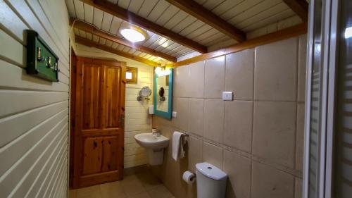 a small bathroom with a toilet and a sink at Shams Hotel & Dive Centre in Dahab