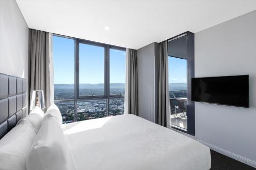 a hotel room with a view of the ocean at Meriton Suites Southport in Gold Coast