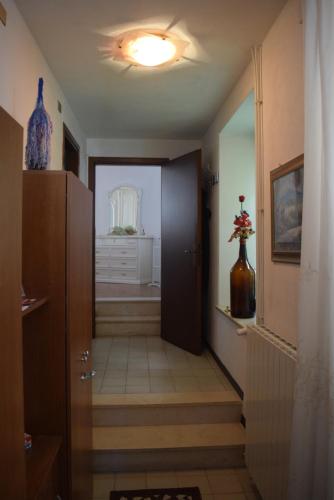 a hallway with a door leading to a room at Al Borghetto in Montegrino Valtravaglia