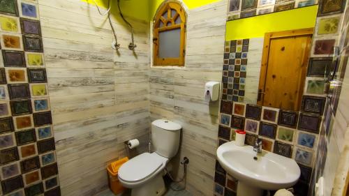 a bathroom with a toilet and a sink at Shams Hotel & Dive Centre in Dahab