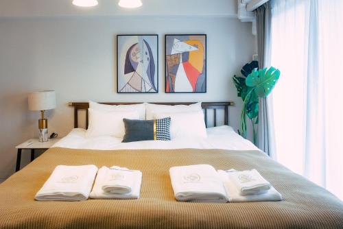 Ένα ή περισσότερα κρεβάτια σε δωμάτιο στο 谷町君 HOTEL 日本橋47