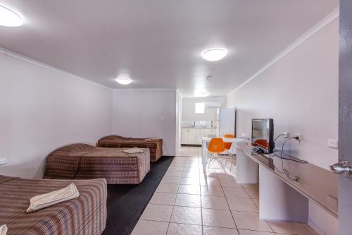 Χώρος καθιστικού στο Galaxy Mackay Motor Inn