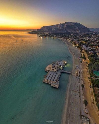 an aerial view of a beach at sunset at B&B D'Amari Affittacamere in Palermo