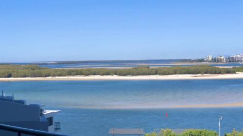 a view of a body of water with a beach at Amazing Views, Walk Everywhere! in Caloundra