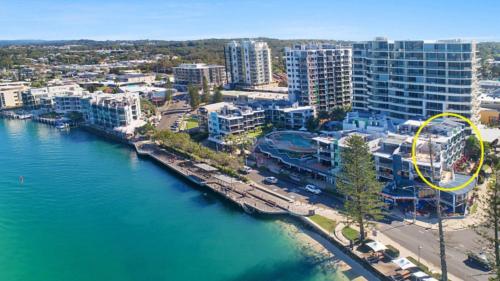 an aerial view of a city next to the water at #55 Grand Pacific Resort, Outdoor Spa With A View! in Caloundra