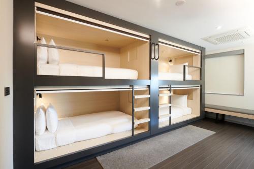 a room with four bunk beds in it at Nine Tree by Parnas Seoul Dongdaemun in Seoul