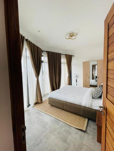 Llit o llits en una habitació de MERCURE HOTEL