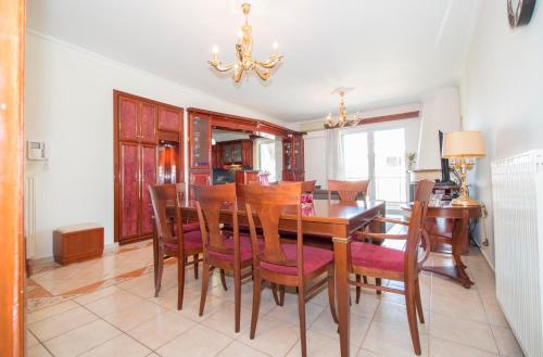 a dining room with a table and chairs at Spartan 5th floor apartment in Sparti
