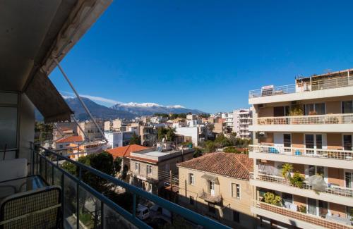 a view of the city from a balcony of a building at Spartan 5th floor apartment in Sparti