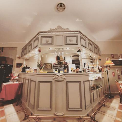 a large kitchen with an island in a room at Boutique Hotel Fox's Inn in San Giustino Valdarno