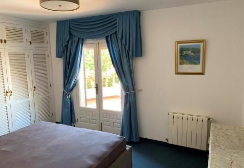 A bed or beds in a room at Casa Pera