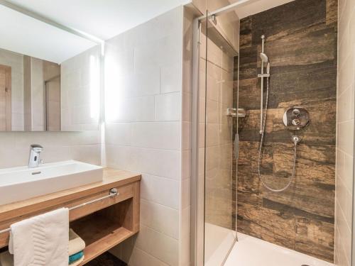 a bathroom with a shower and a sink at Apartment in Wald near Zillertal Ski Slopes in Wald im Pinzgau