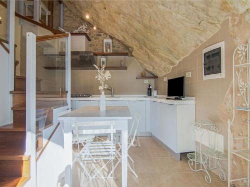 A television and/or entertainment centre at Apartment in Petrella Guidi with Medieval Charm