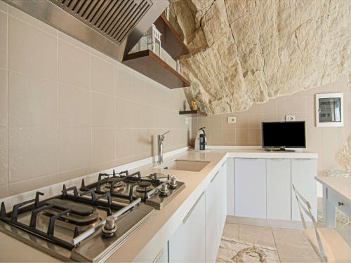 A kitchen or kitchenette at Apartment in Petrella Guidi with Medieval Charm